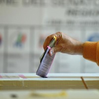 Italy's voter casts their ballots at a p