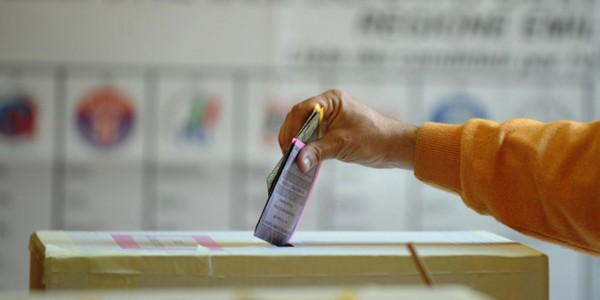 Italy's voter casts their ballots at a p