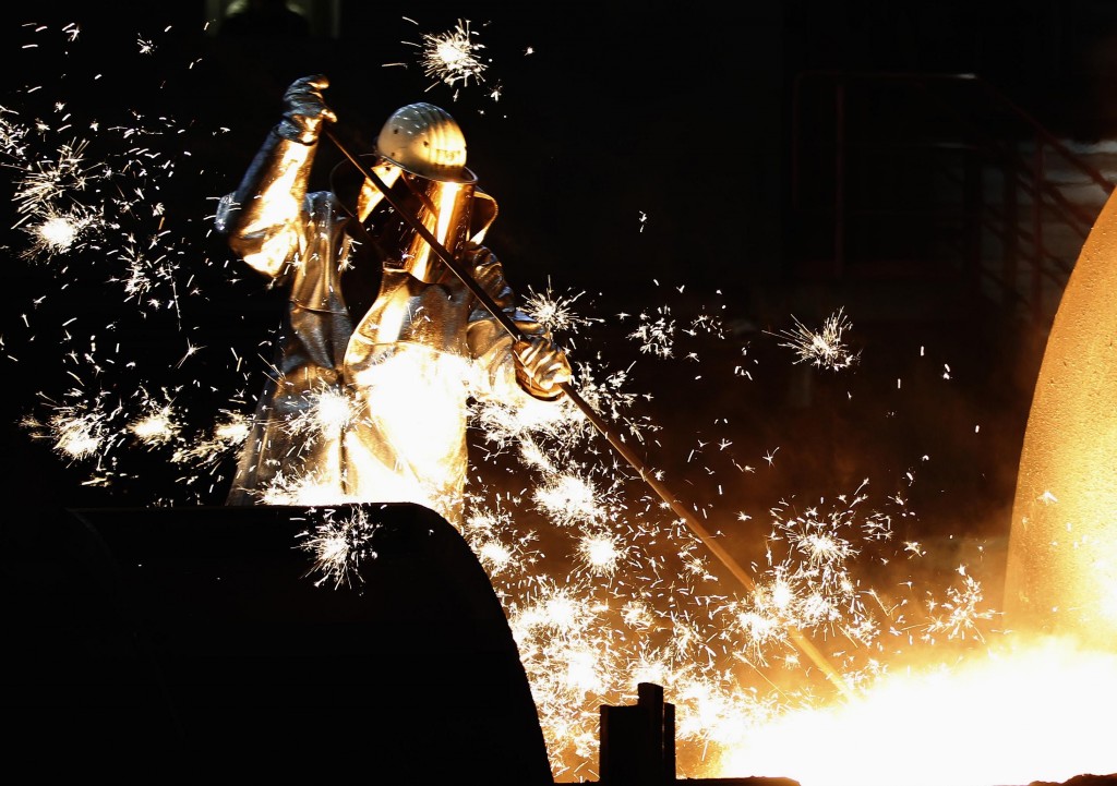 A worker of German steelmaker ThyssenKrupp controls a blast furnace in Duisburg