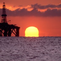 Oil rig at sunset